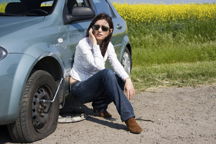 Woman with flat tire